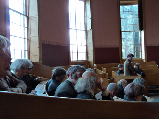 Court room whispers of judgement. 