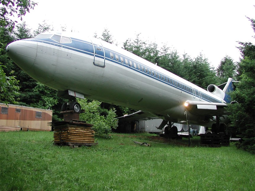 Industrious recycler living in an airplane in the midst of an Oregon&nbsp;forest