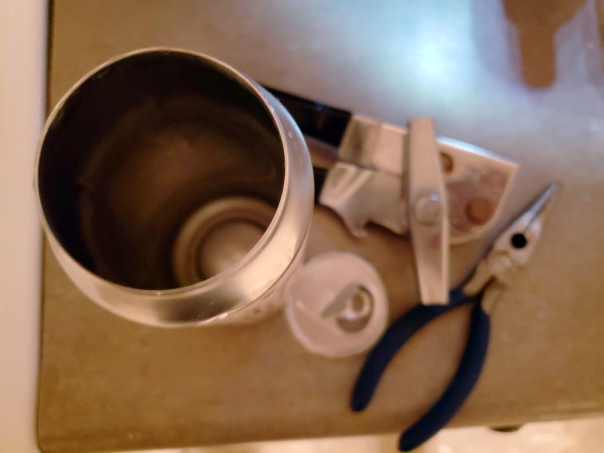 remove beer lid using a can opener